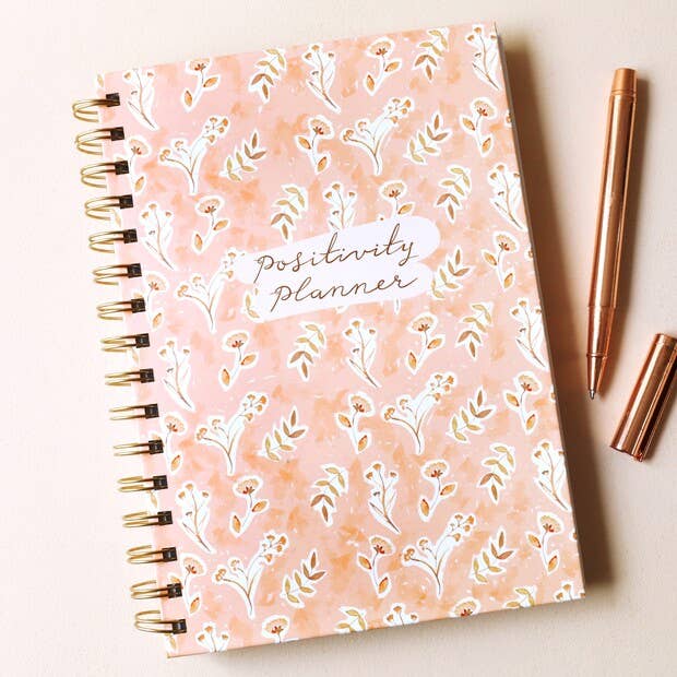 Floral positivity journal with peachy-pink hardcover design