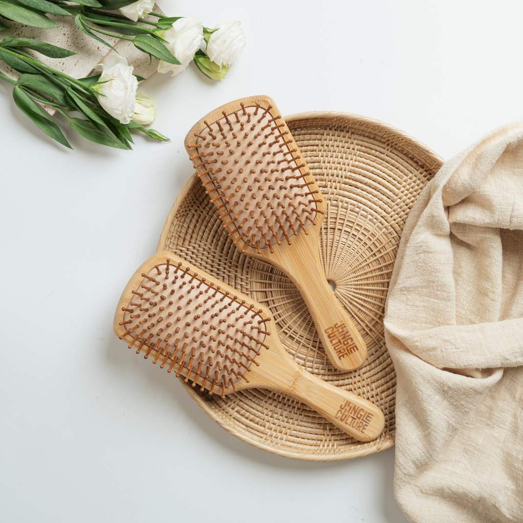 Close-up of natural bamboo bristles on 2 eco-friendly hairbrushes