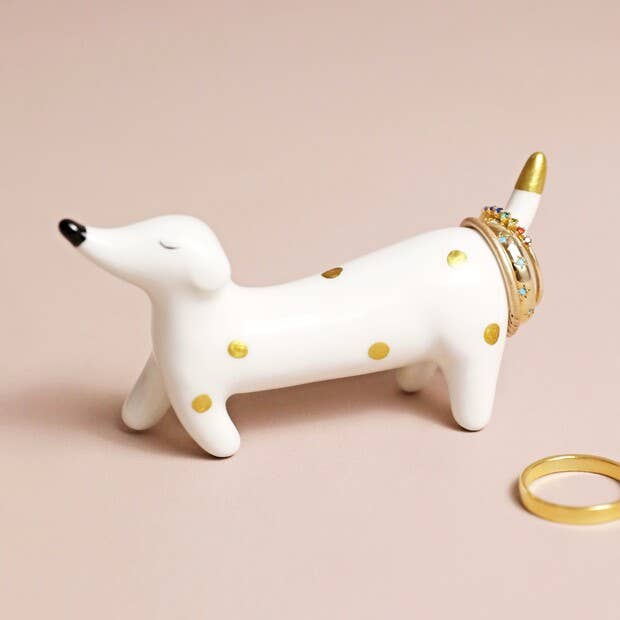 Ceramic dachshund ring holder with gold polka dots on blush background