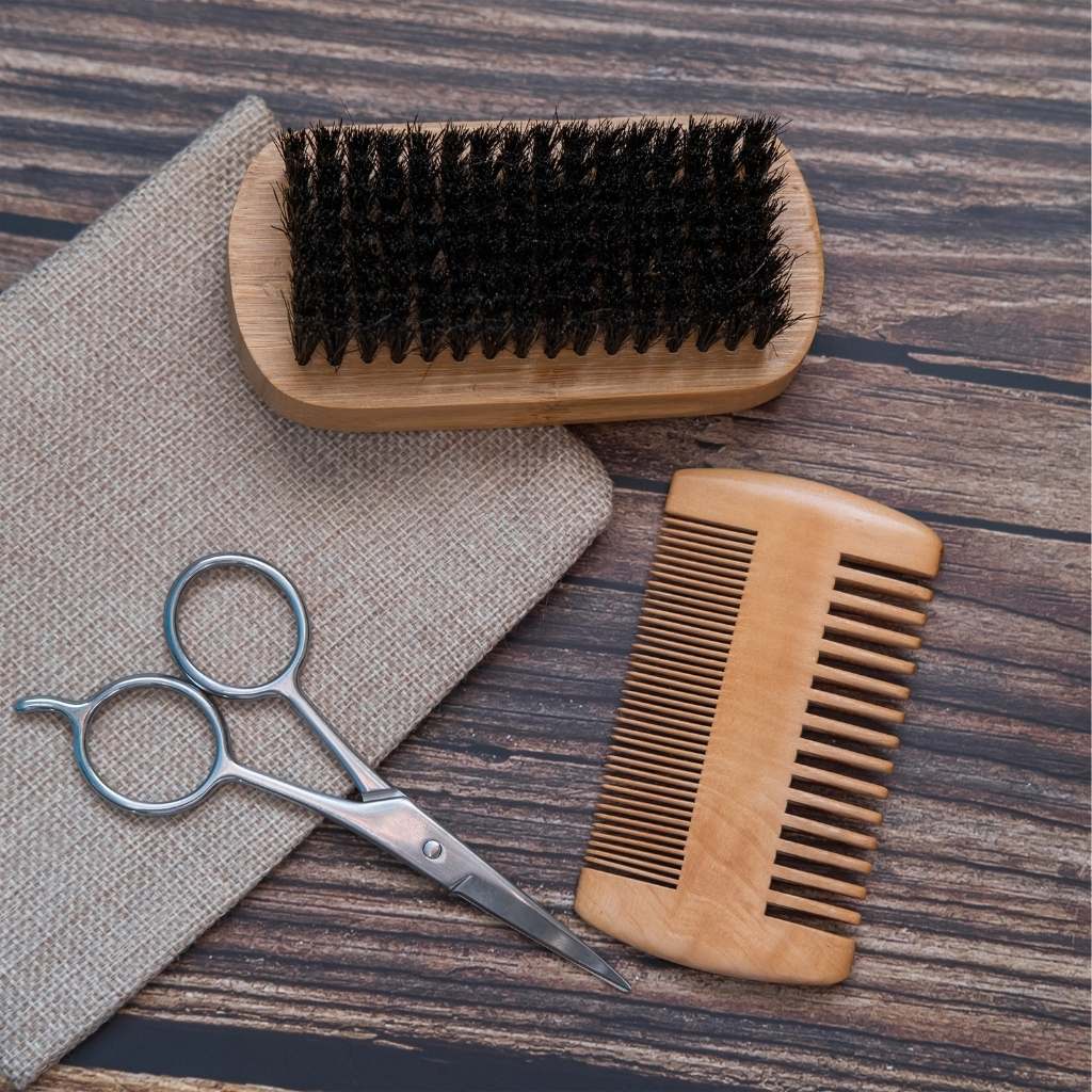Close-up of fine teeth on beard comb with smooth wood grain finish with other grooming utensils
