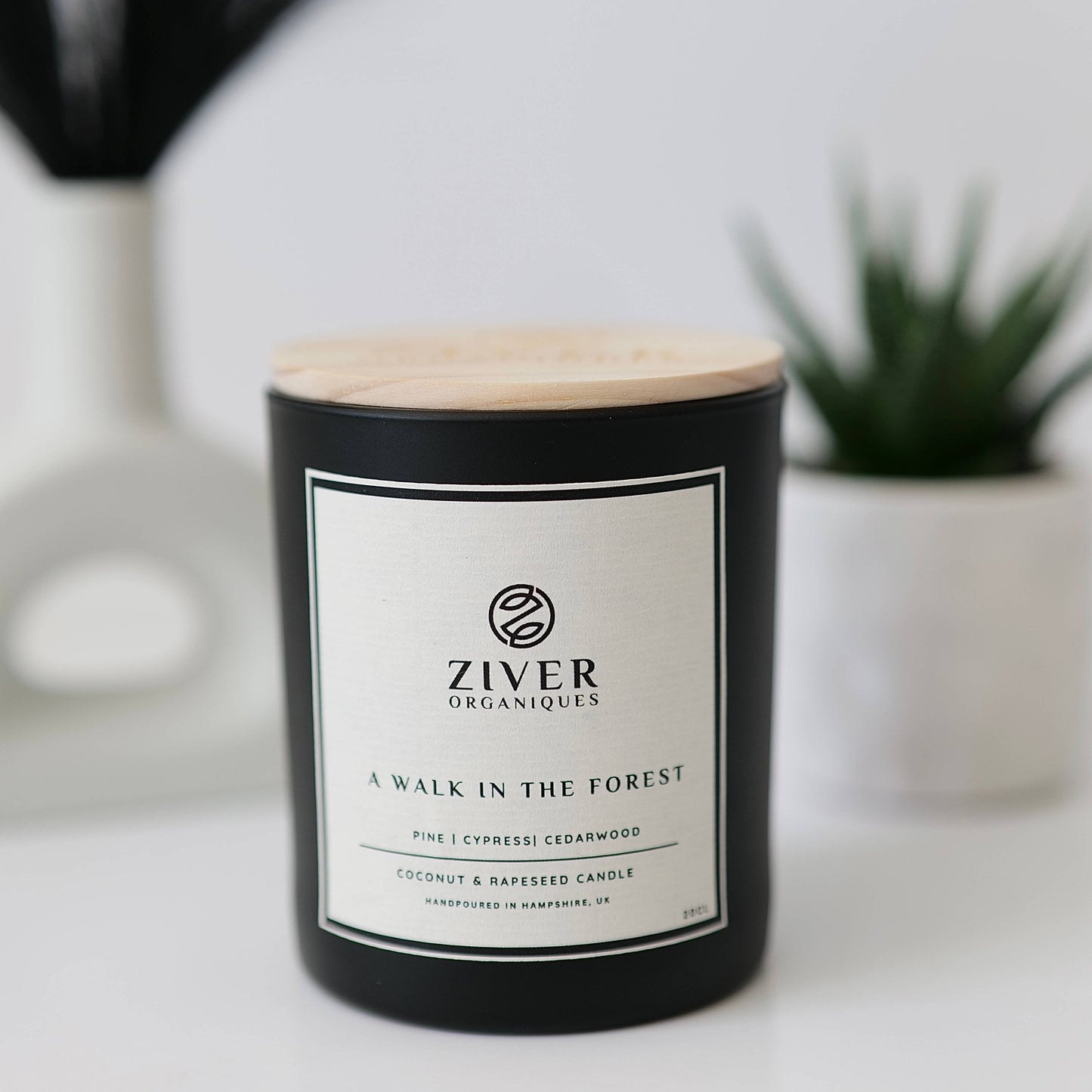 Cedarwood pine and cypress candle in glass jar on kitchen surface