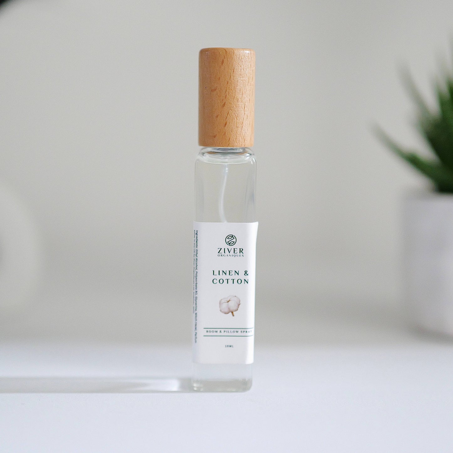 Fresh Linen room spray in glass bottle with soft towels in background