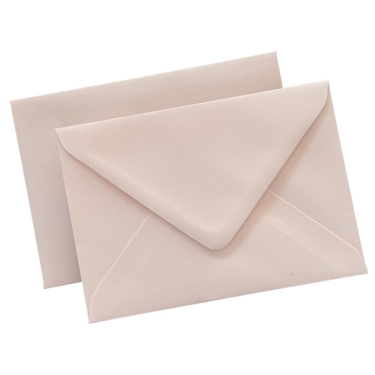 blush envelopes flat lay against isolate white background, showing the diamond flap envelopes from the front and the reverse.