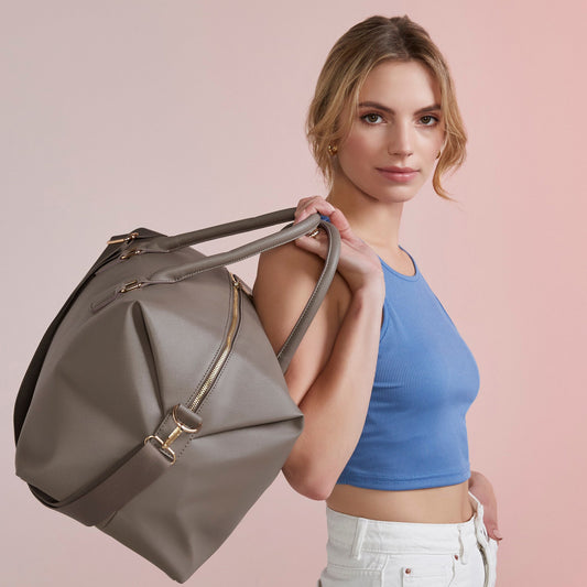 Taupe personalised weekender bag with gold zip and name print