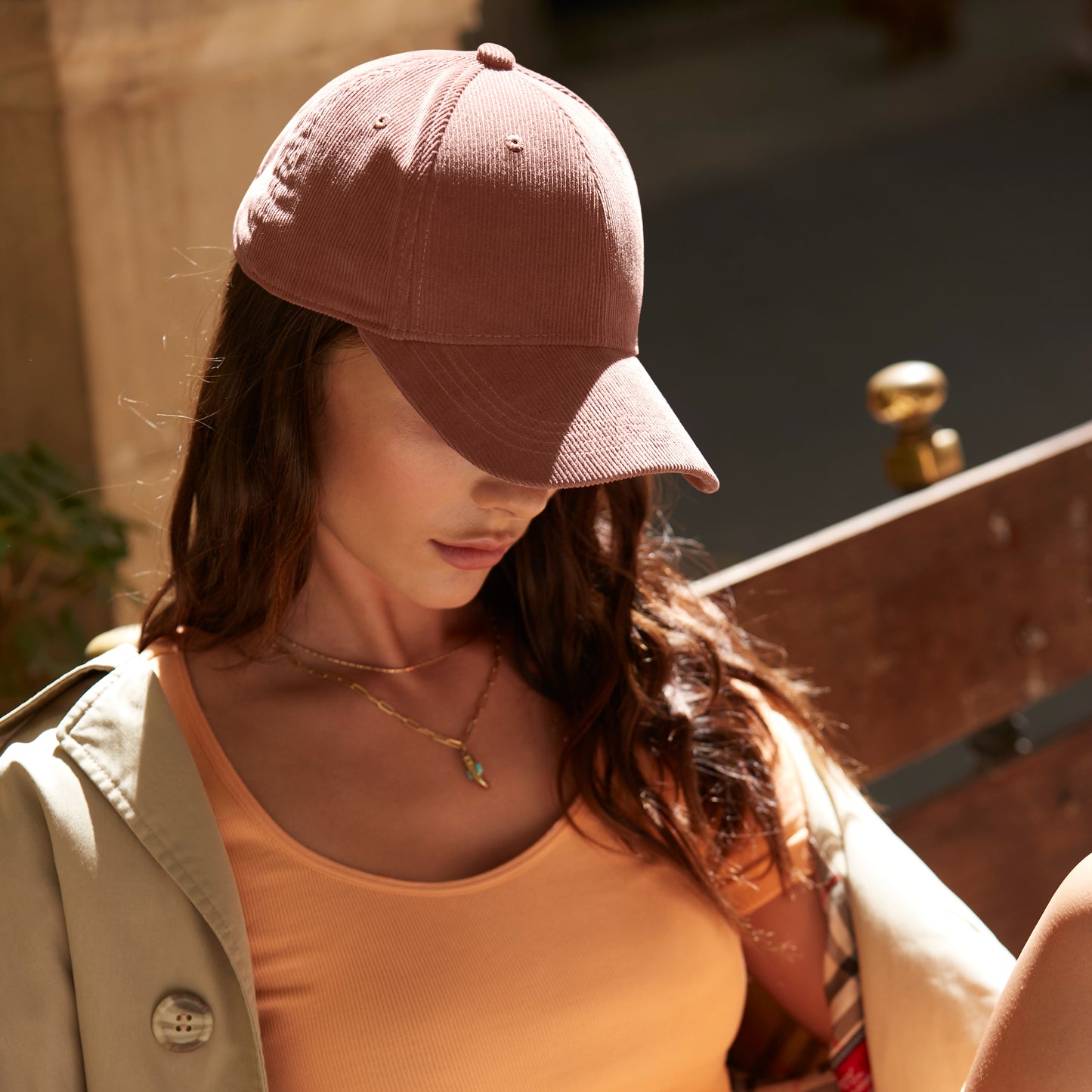 Close-up of soft cotton corduroy texture and brass-effect buckle