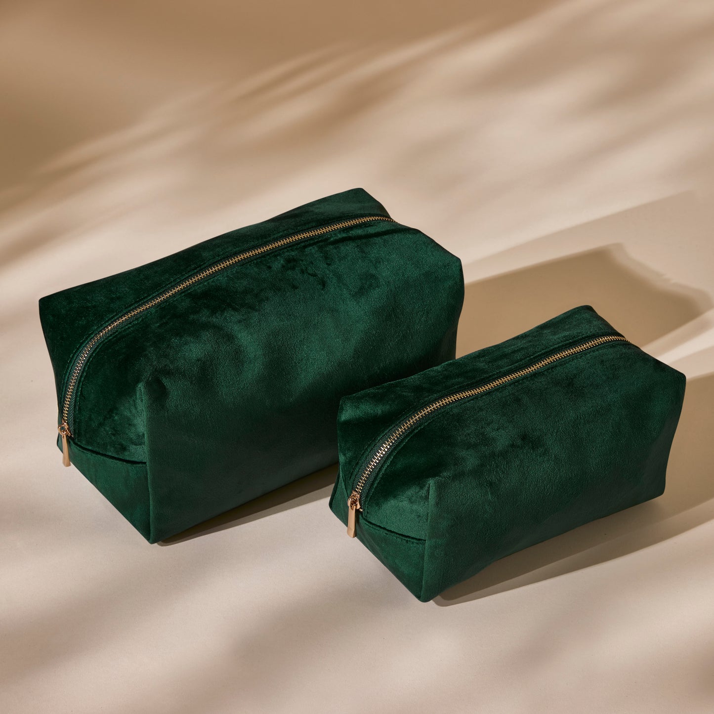 Medium and large velvet wash bags shown side by side