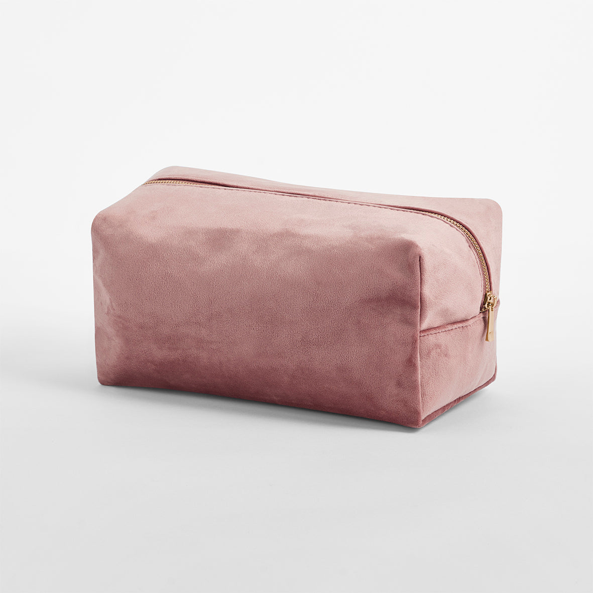 Pink velvet toiletry bag in rich colour with gold zip