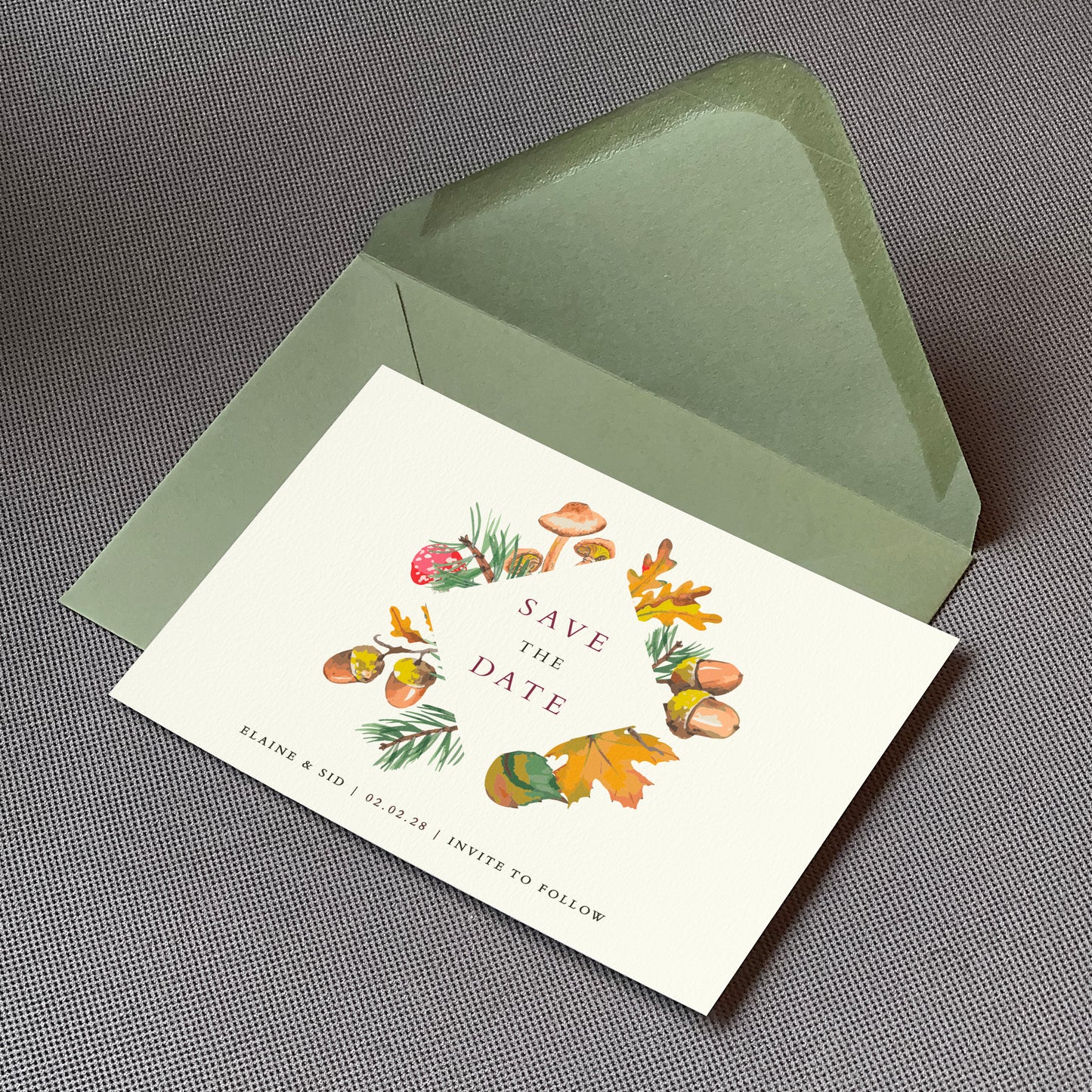 a save the date card sat on top of an envelope on a table