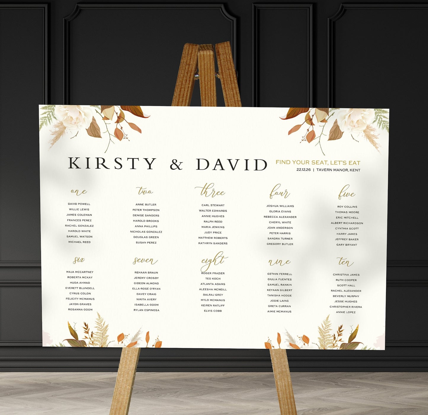 brown florals  wedding Table Plan on a brown easel in a stylish room in a wedding venue