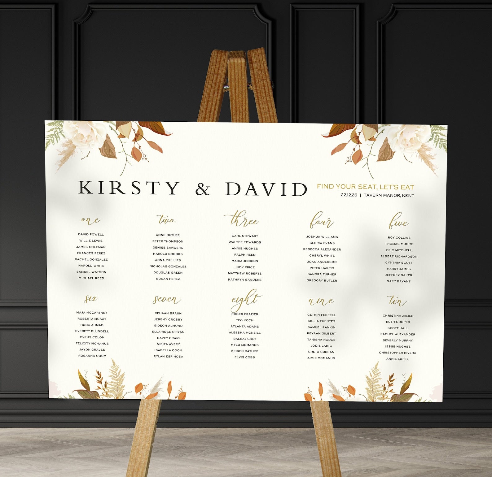 brown florals  wedding Table Plan on a brown easel in a stylish room in a wedding venue