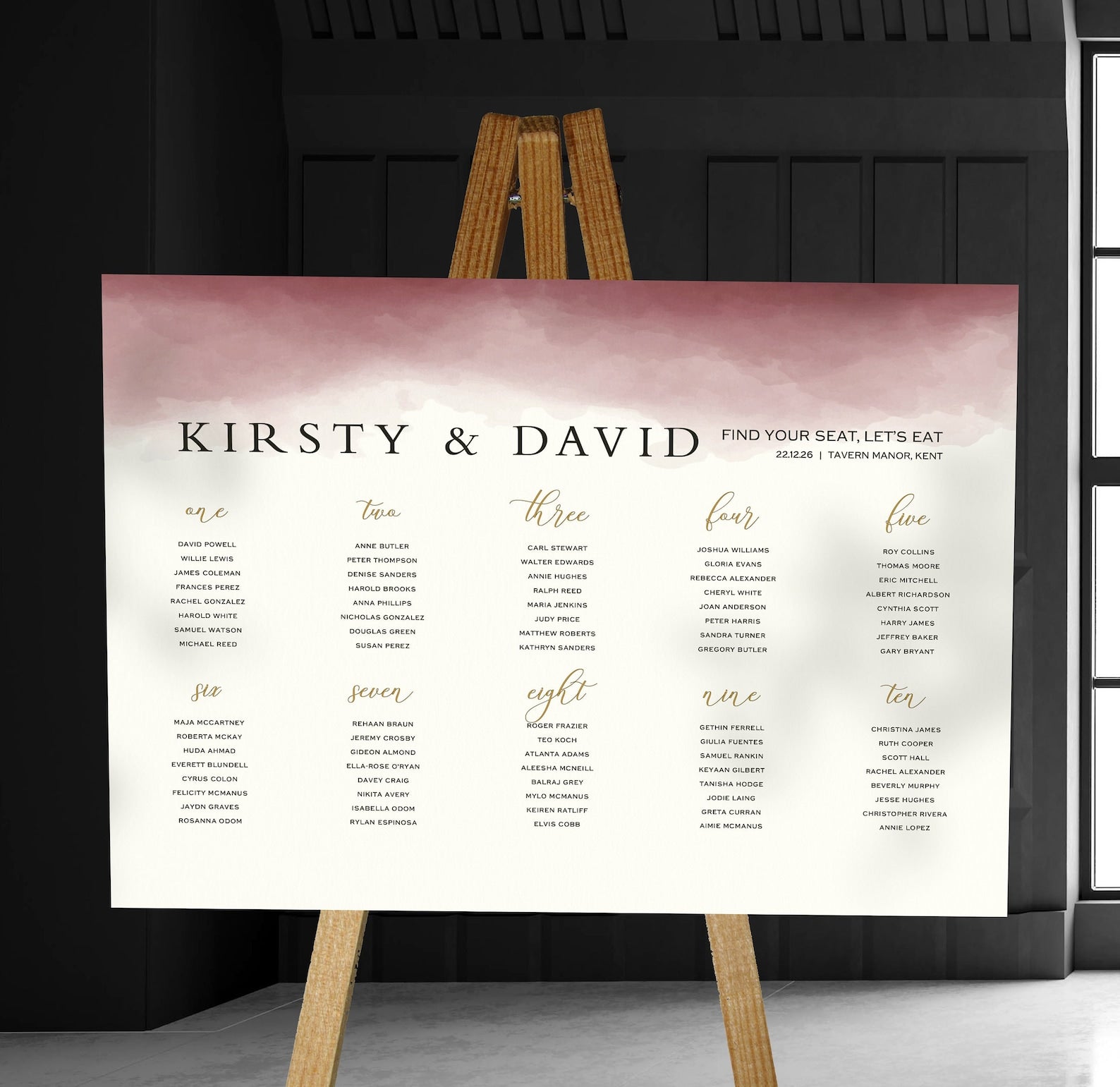 burgundy watercolour wedding Table Plan on a brown easel in a stylish room in a wedding venue