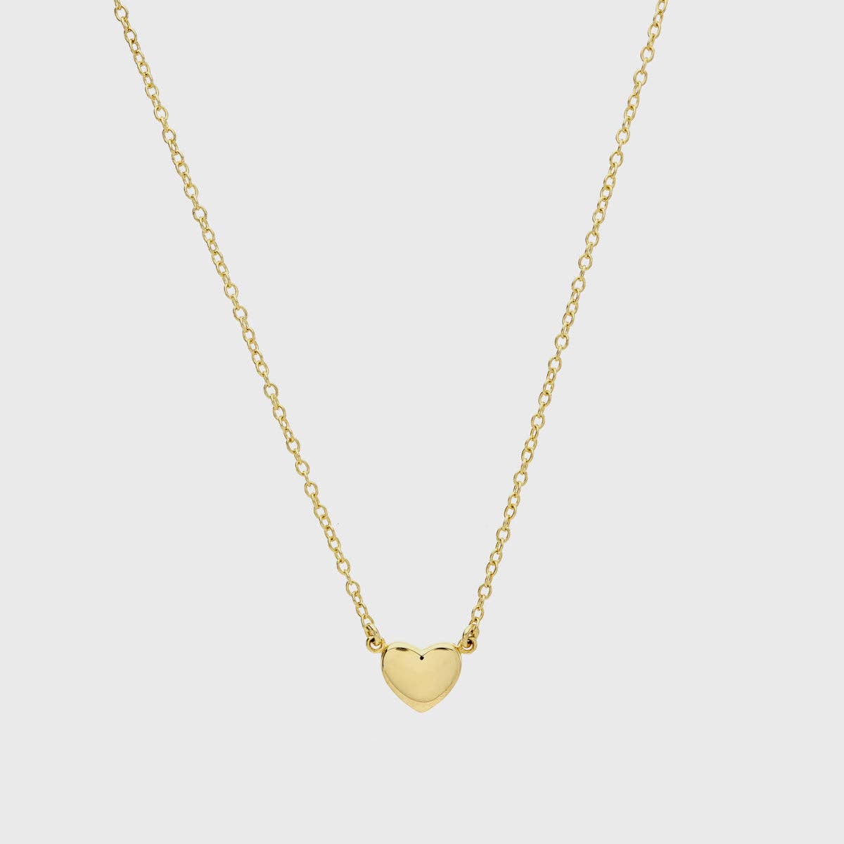 Heart pendant necklace worn alone for minimal gold look