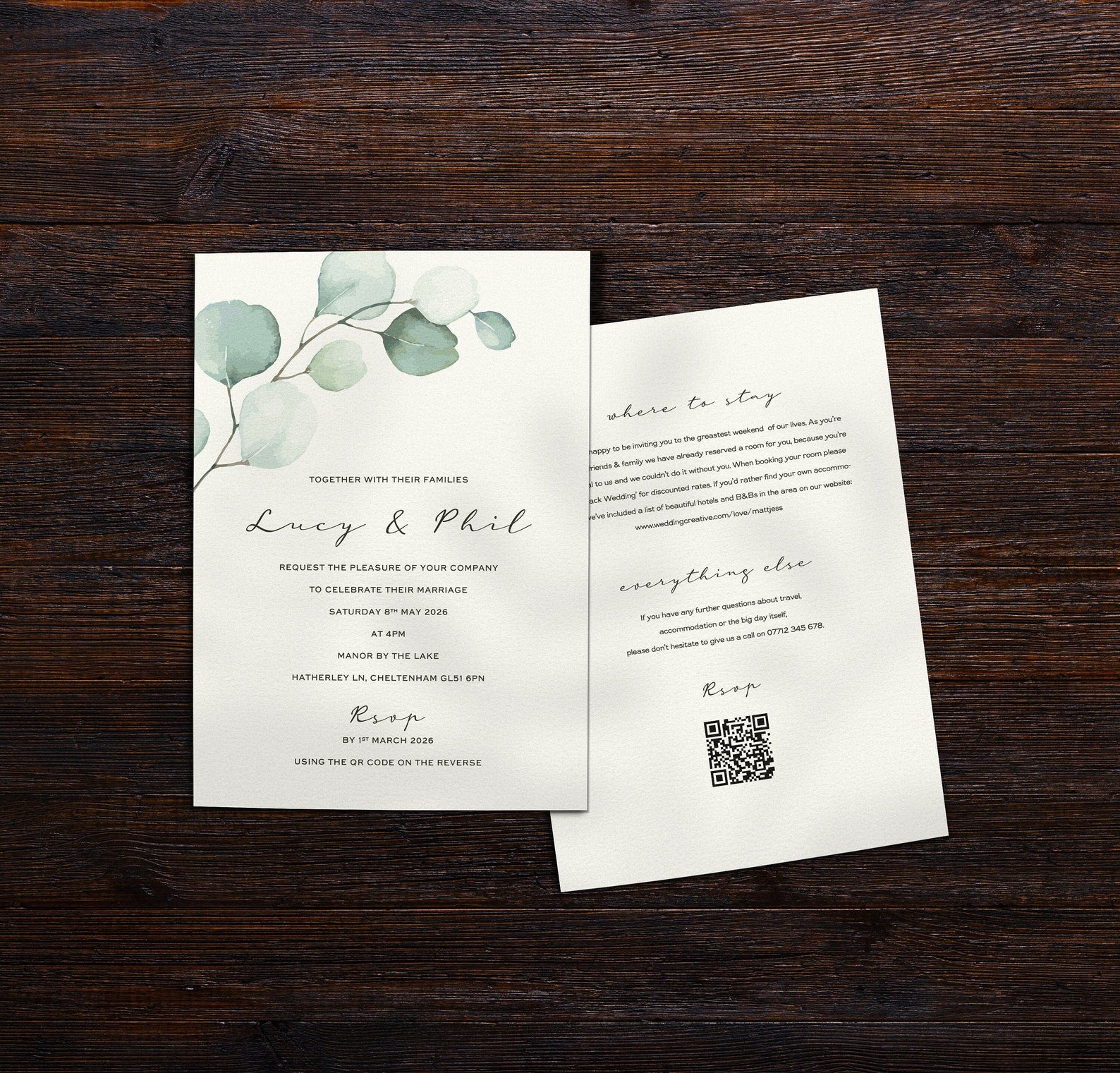 Eucalyptus sage green design on single card, double sided wedding invitations with qr code on the back, set on a dark wooden table