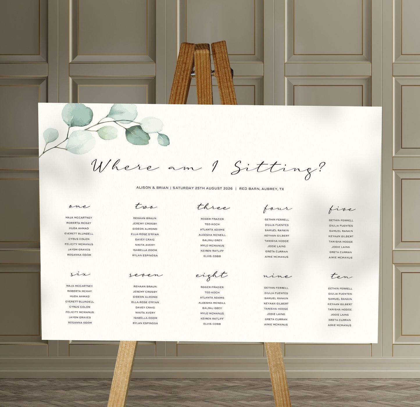 Eucalyptus wedding Table Plan on a brown easel in a stylish room in a wedding venue