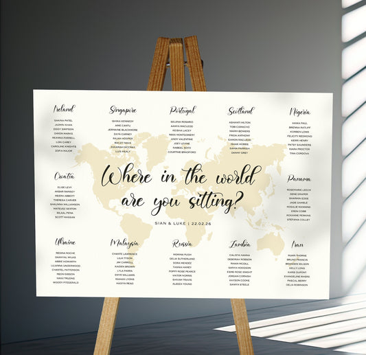 destination wedding Table Plan on a brown easel in a stylish room in a wedding venue