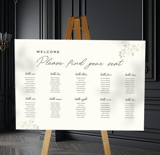 babys breath wedding Table Plan on a brown easel in a stylish room in a wedding venue