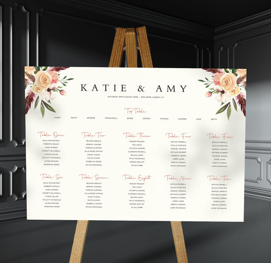 peach, blush and burgundy florals wedding Table Plan on a brown easel in a stylish room in a wedding venue