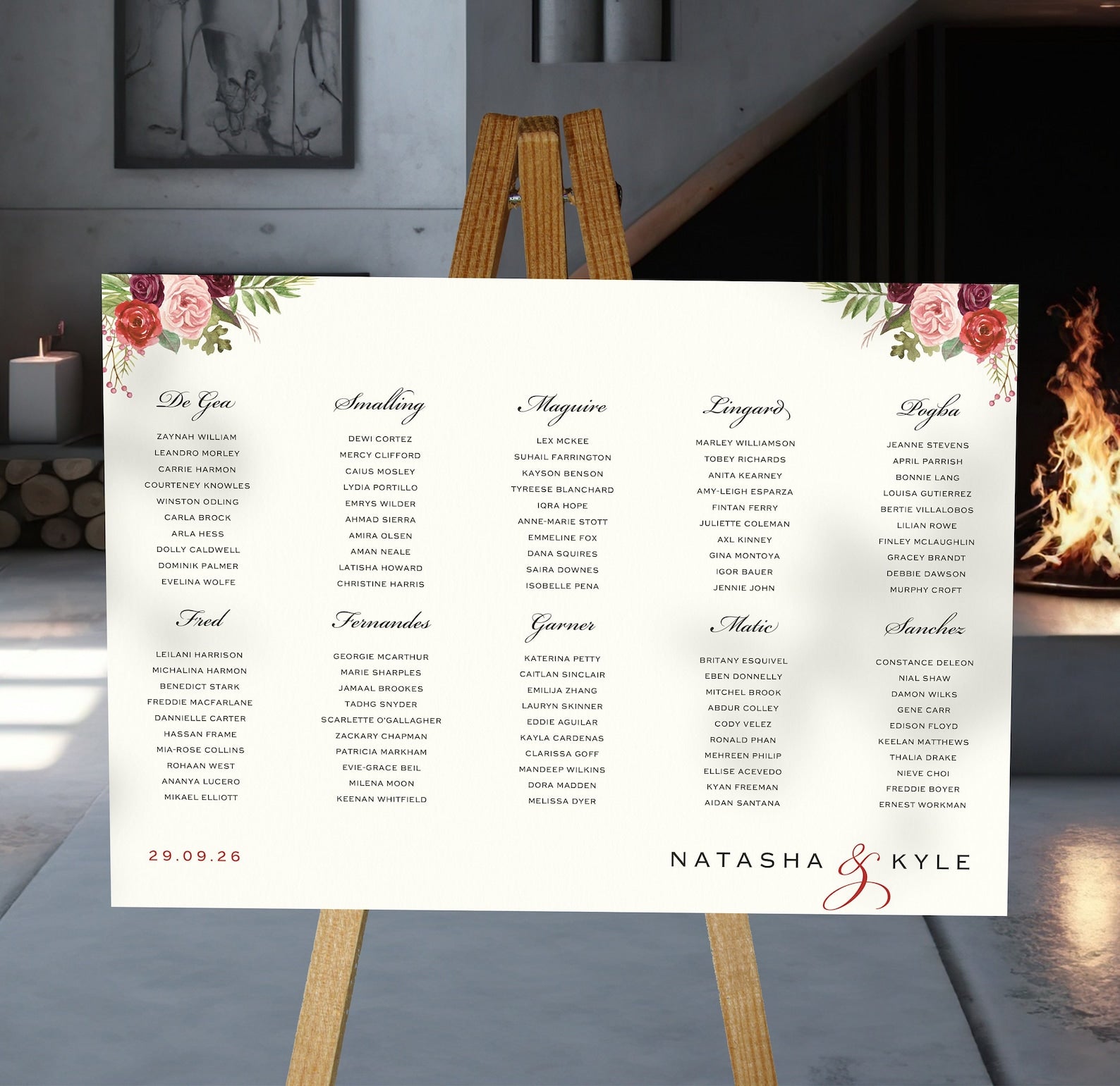 burgundy and blush florals wedding Table Plan on a brown easel in a stylish room in a wedding venue