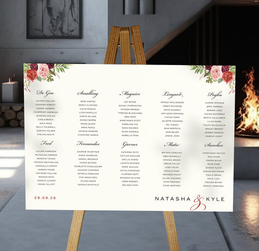 burgundy and blush florals wedding Table Plan on a brown easel in a stylish room in a wedding venue