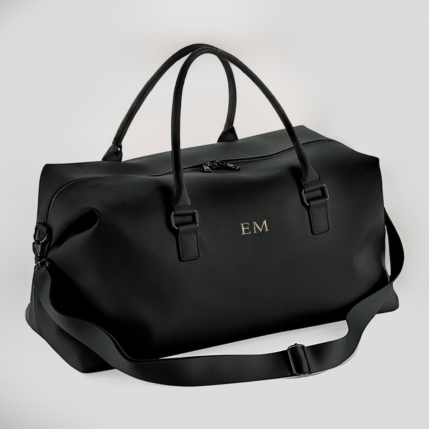 Masculine monogrammed holdall used as gym or travel bag
