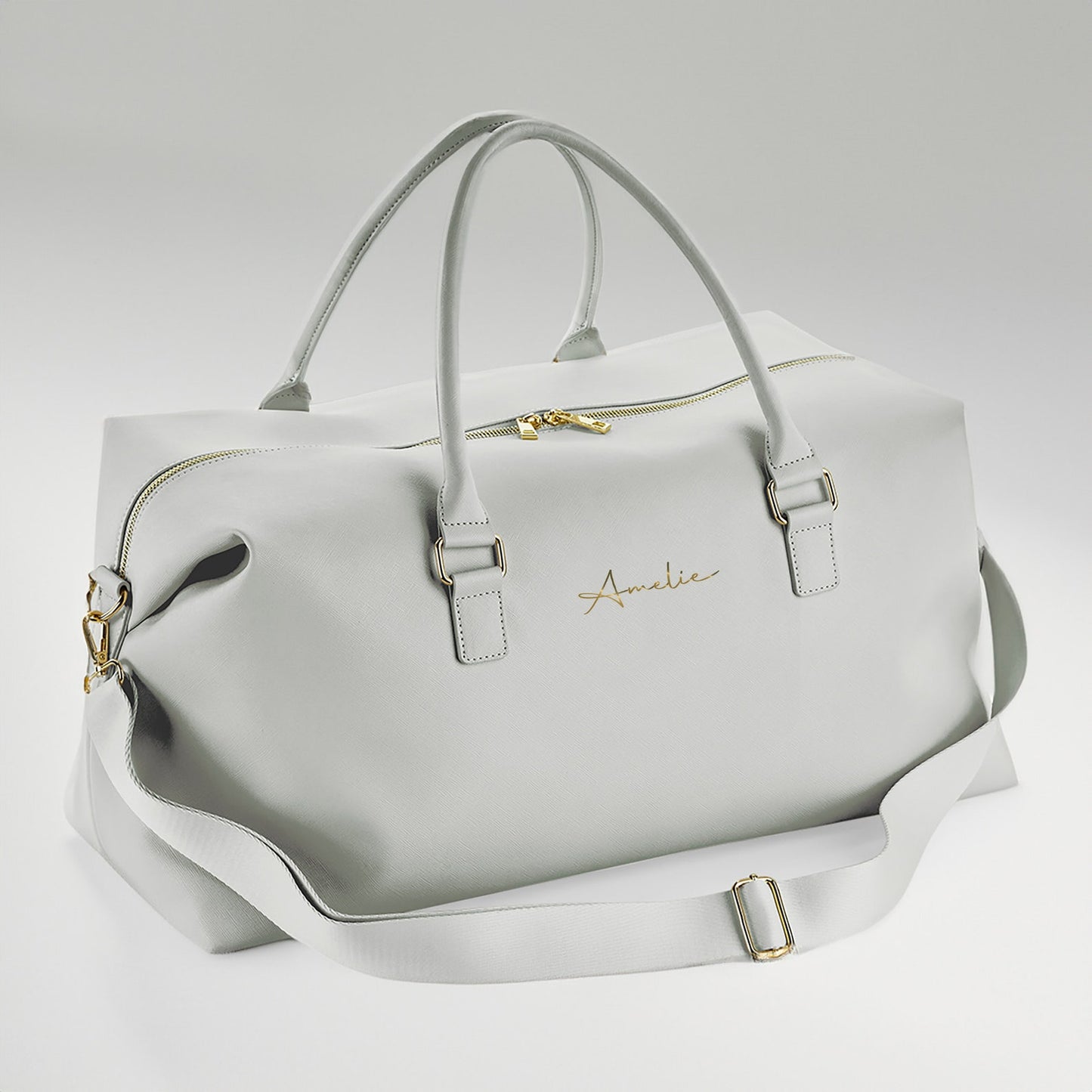 Grey personalised weekender bag with gold zip and name print