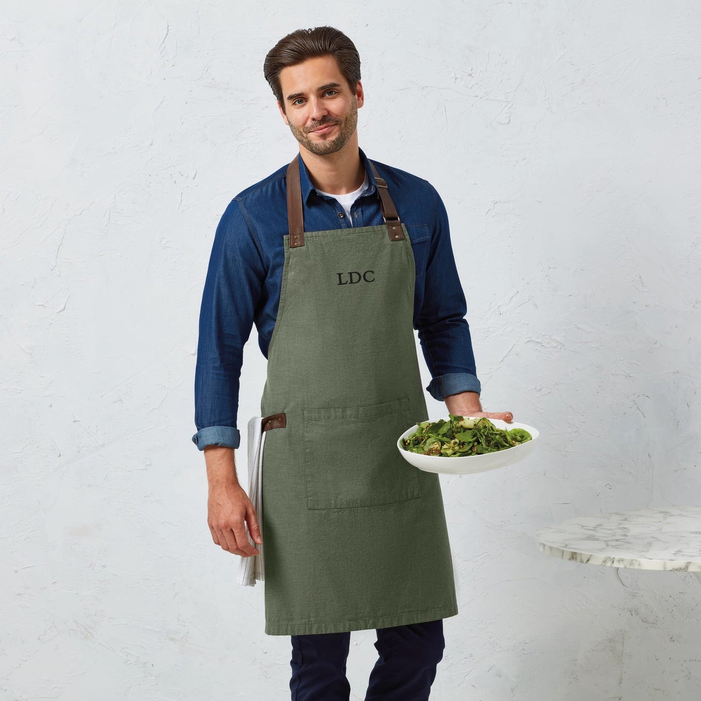 Monogrammed apron with black initial printed on moss green cotton