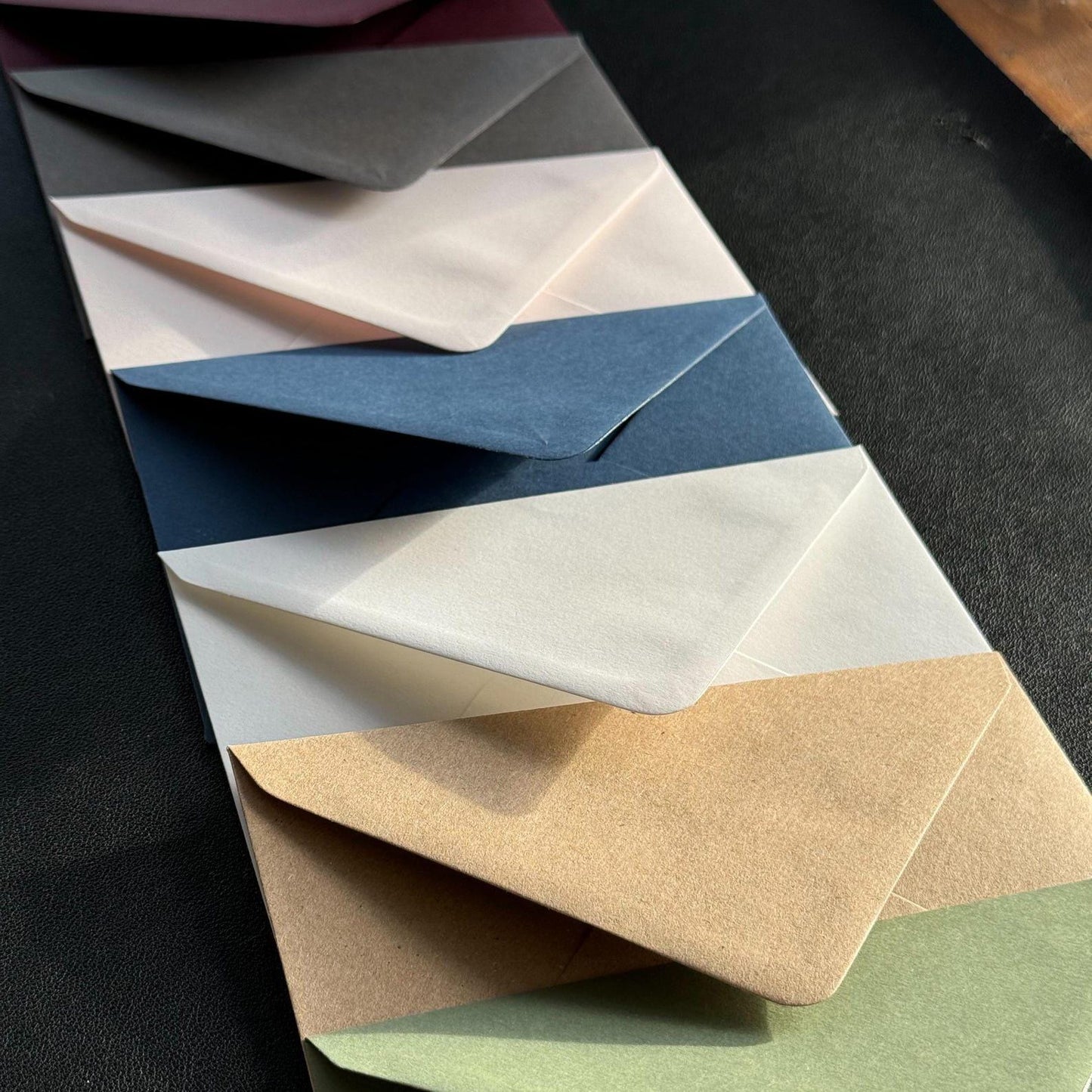 Illustrated wedding thank you card envelopes – sage, blush, burgundy, grey, white, blue, black in natural light