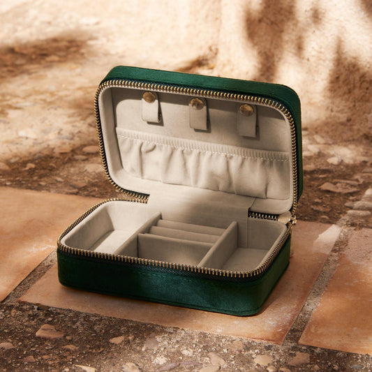 Open jewellery box showing organised ring, earring and necklace compartments