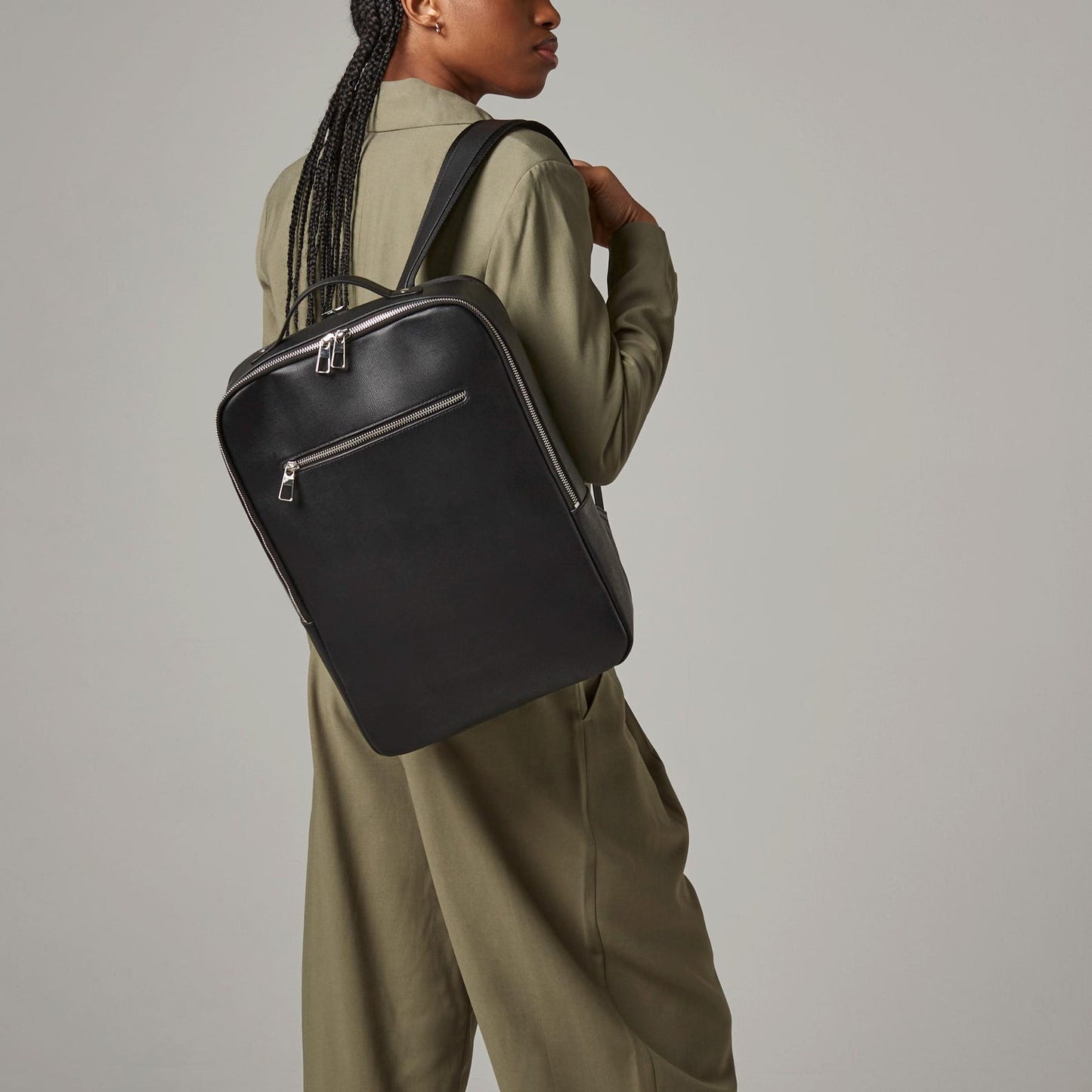 Woman wearing personalised backpacks as a matching travel set