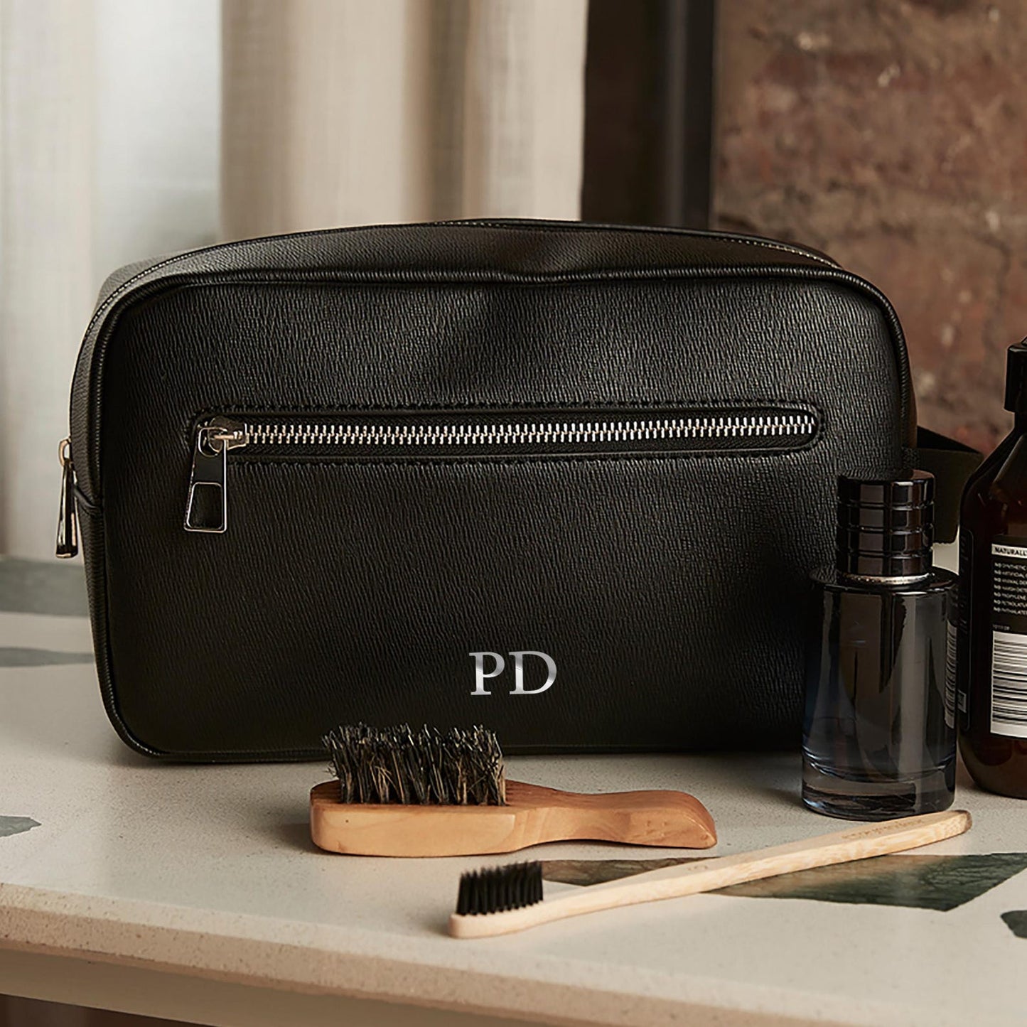 Personalised wash bag in faux leather with silver initials on front