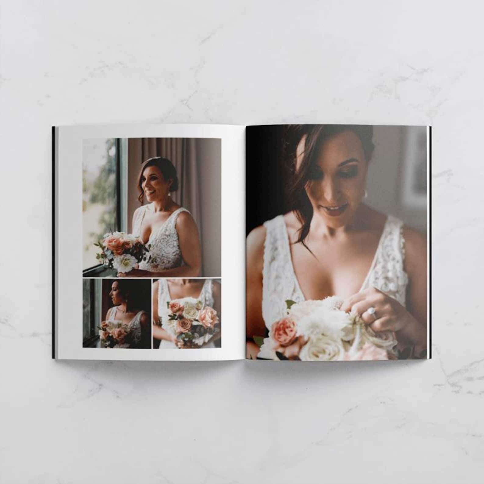 Hardcover personalised wedding photo album open on coffee table with couple's photos displayed