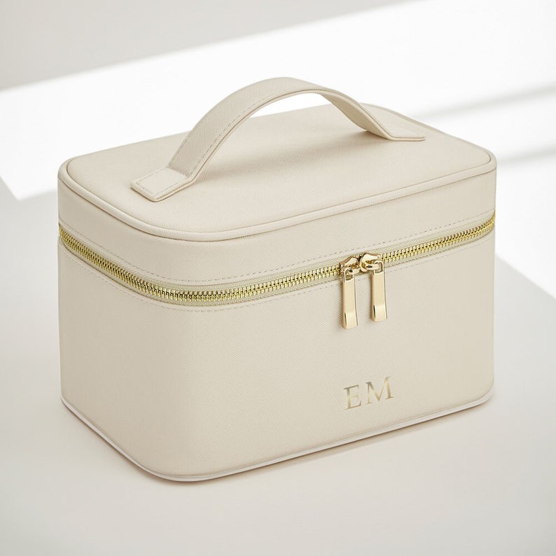 Structured make up bag open to reveal soft-touch interior lining