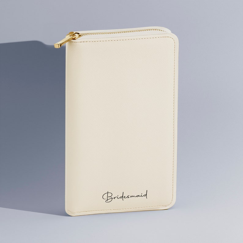Personalised jewellery travel case with gold initials on faux leather purse-style design