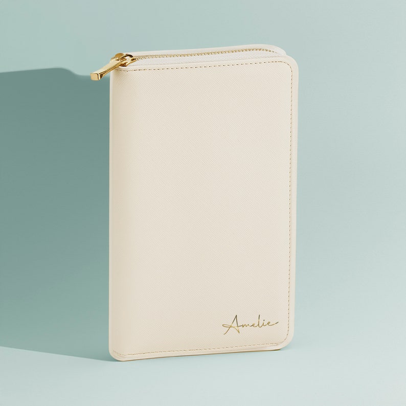 Personalised jewellery travel case with gold initials on faux leather purse-style design