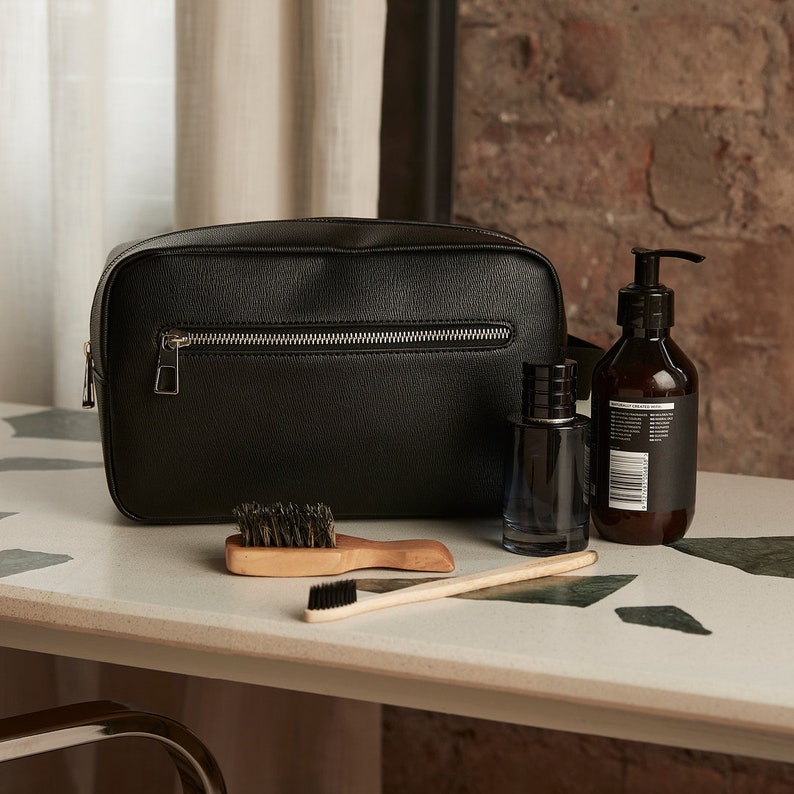 Travel grooming set featuring monogrammed wash bag for men