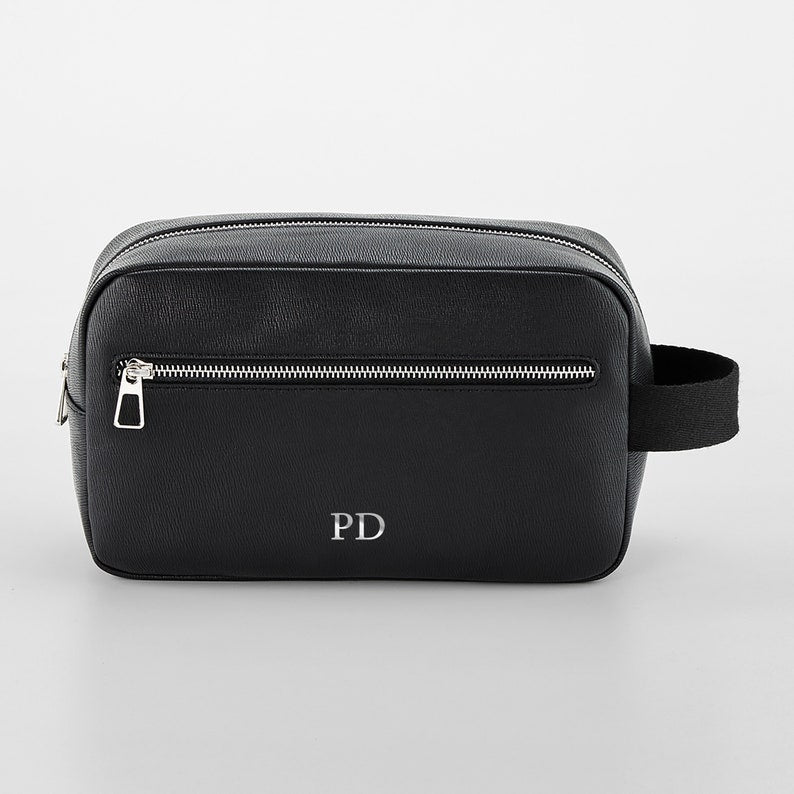 Luxury toiletry bag with zipped compartments and internal organiser