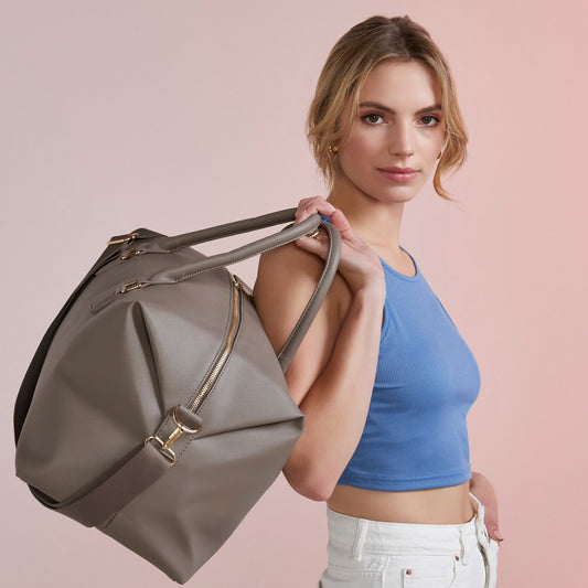 Taupe personalised weekender bag with gold zip and name print

