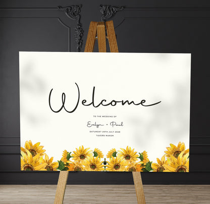 sunflowers A1 welcome sign board on a brown easel in a wedding venue room with stylish decor