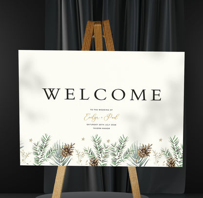 green and brown christmas winter design A1 welcome sign board on a brown easel in a wedding venue room with stylish decor