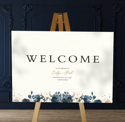 blue florals A1 welcome sign board on a brown easel in a wedding venue room with stylish decor
