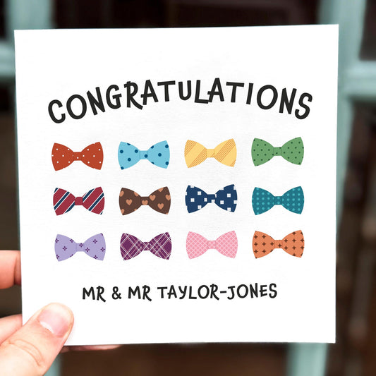 Wedding congratulations card featuring a pattern of colourful bow ties with the text ‘Congratulations’.