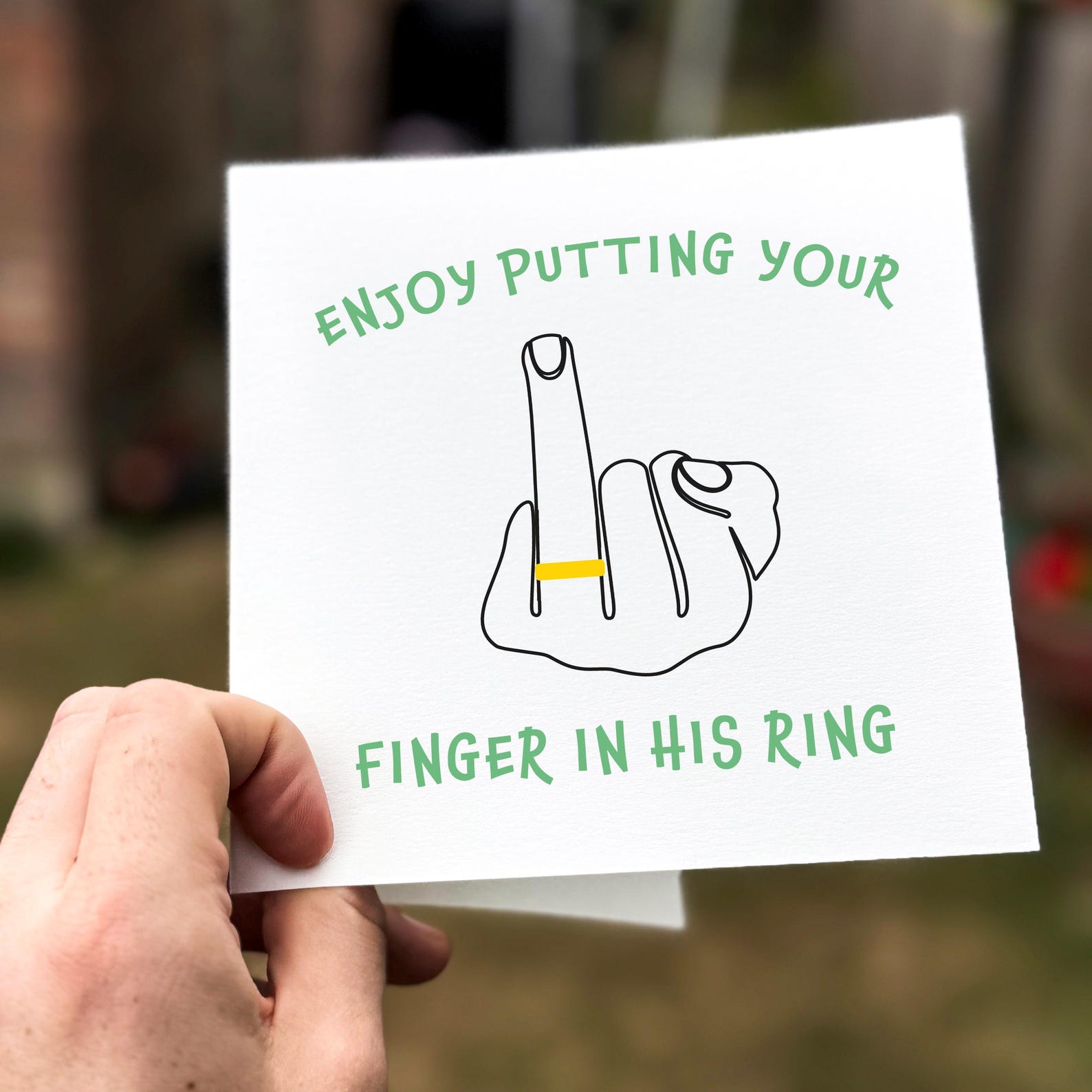 Funny wedding card featuring a hand-drawn line art hand with ring and humorous text ‘Enjoy Putting Your Finger In His Ring’.