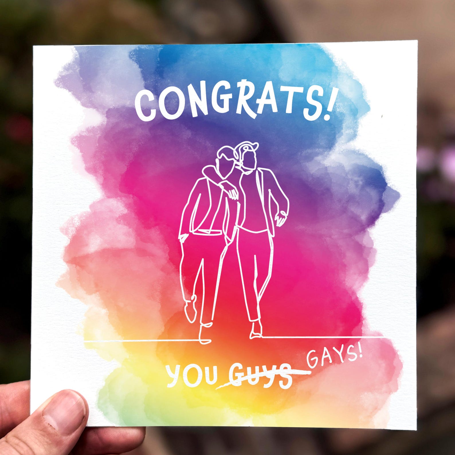 Rainbow wedding congratulations card featuring two grooms in line art with colourful background and text ‘Congrats You Gays’.