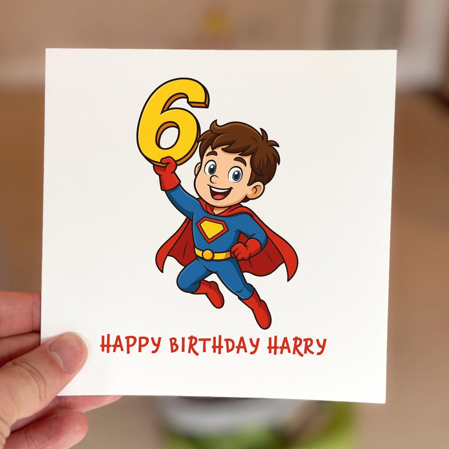 Kids birthday card with a cartoon superhero flying while holding a yellow number six, printed on textured card.