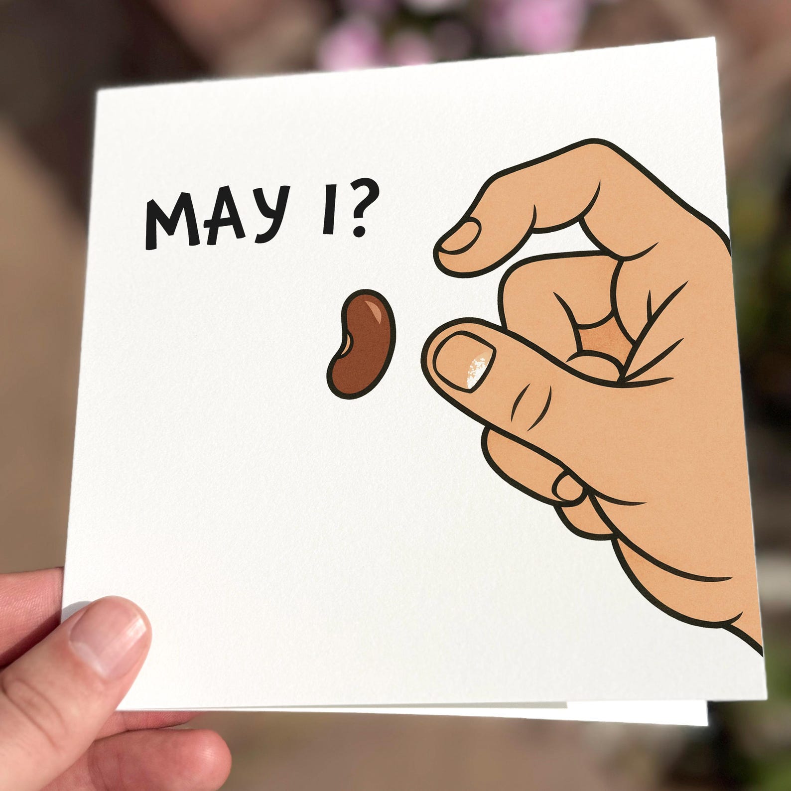Funny card featuring a hand holding a small bean with the text ‘May I?’.
