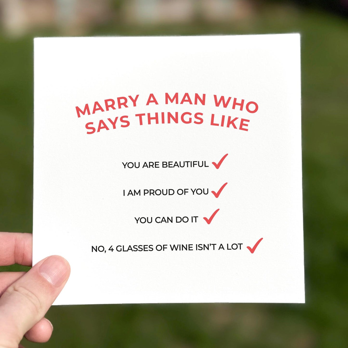 Funny relationship card featuring red checklist phrases about love, pride and humour.
