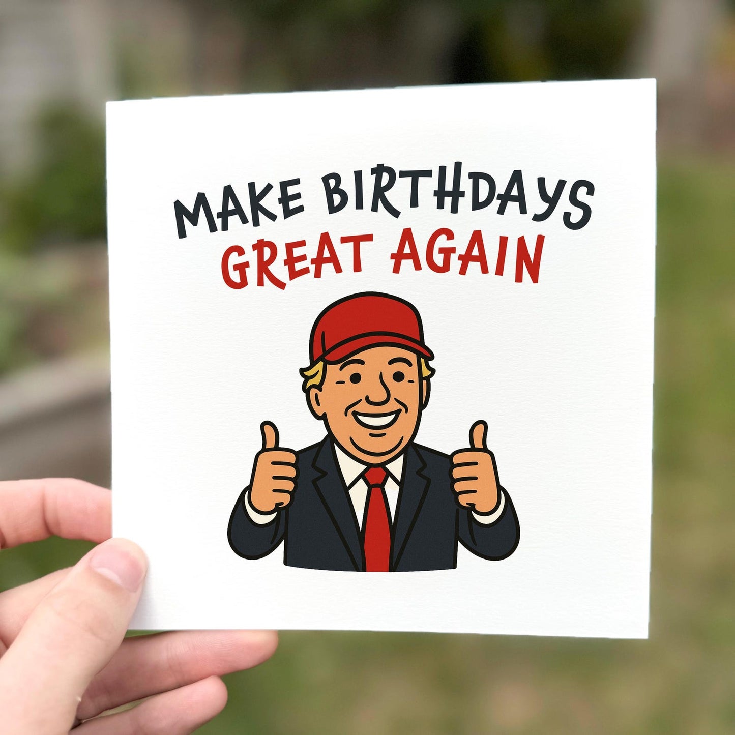 Funny birthday card featuring a cartoon man in a suit and red hat with the slogan ‘Make Birthdays Great Again’.