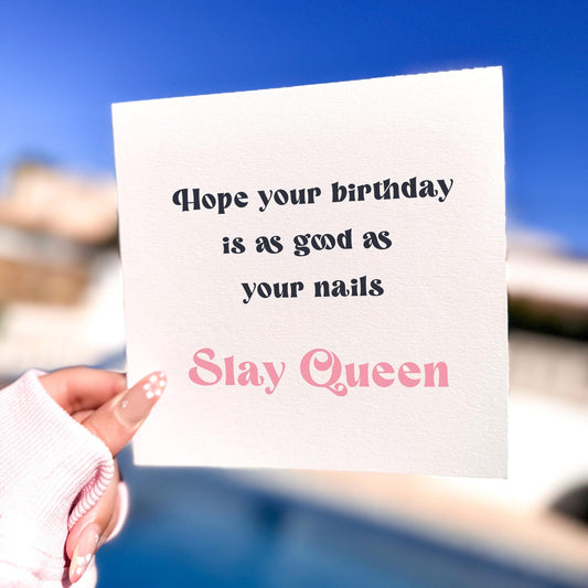Stylish birthday card with the text ‘Hope your birthday is as good as your nails – Slay Queen’ held outdoors.