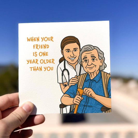 Funny friendship birthday card showing a nurse and elderly woman with the text ‘When your friend is one year older than you’.