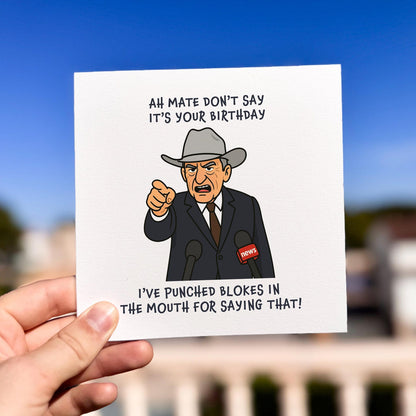 Funny Australian-themed birthday card with a cartoon man in a hat pointing and shouting into microphones.